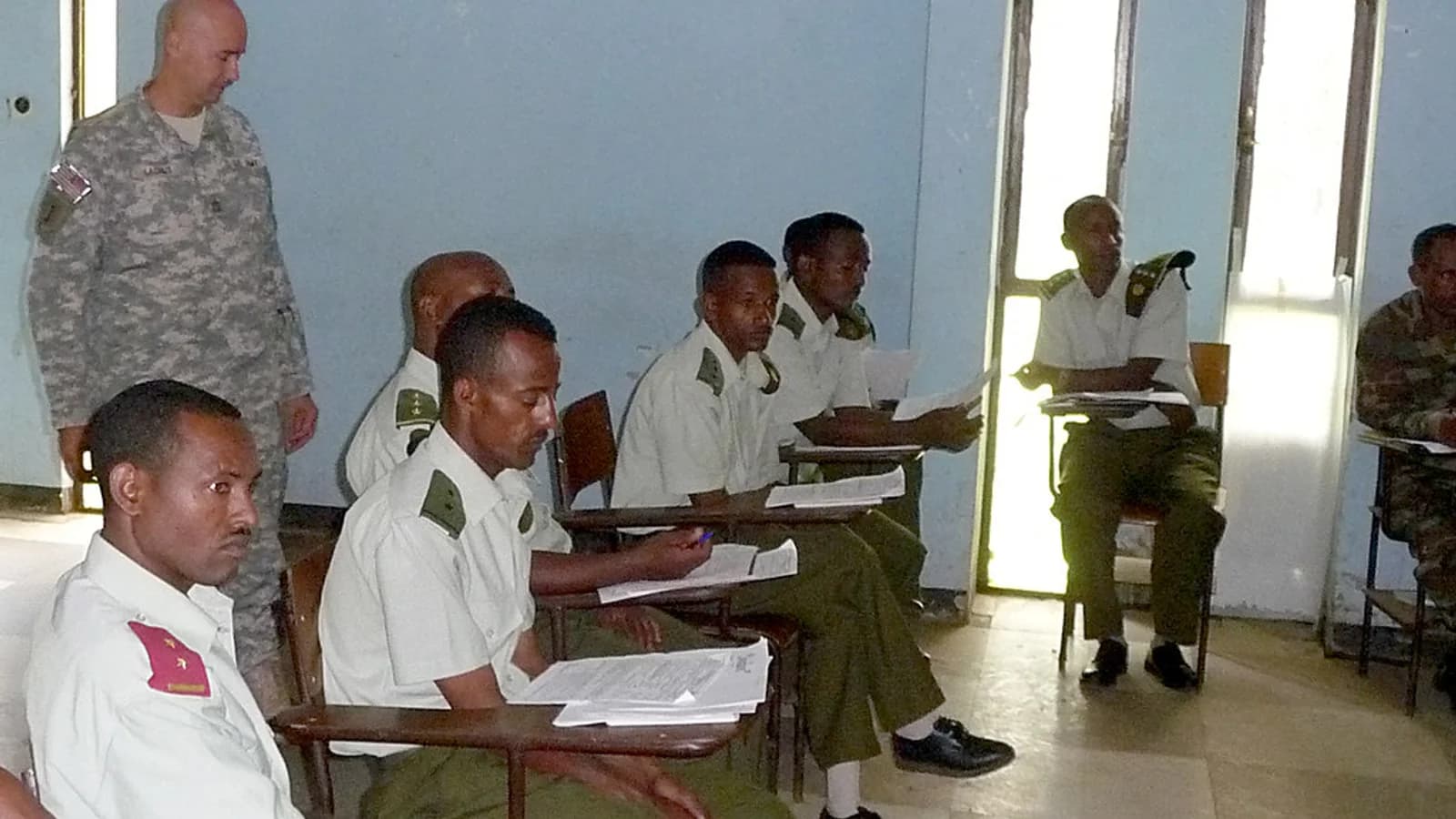 Training provider staff reviewing learner evidence for How do I connect accreditation, learner records, certificates, and verification?