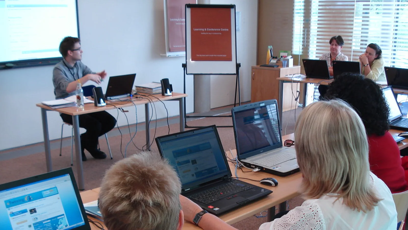 Quality manager organising digital accreditation evidence for How do I create an accreditation dashboard for management?